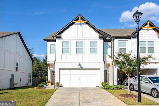 view of front facade with a garage and a front lawn