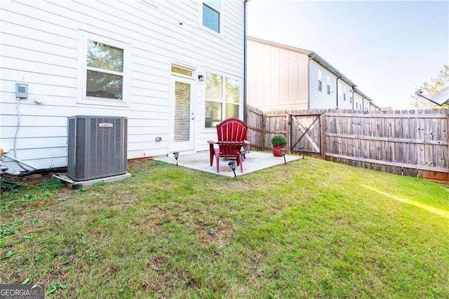 view of yard featuring cooling unit and a patio