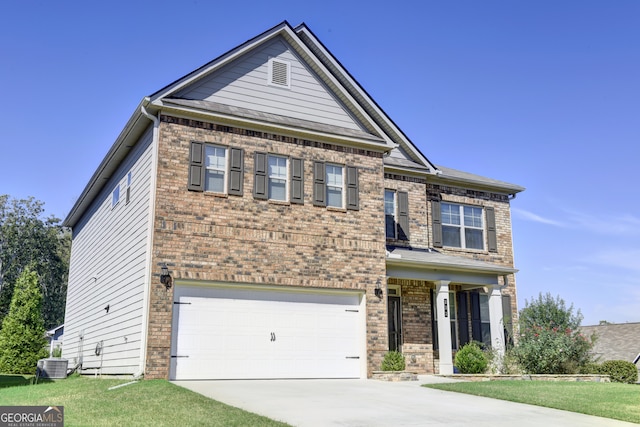 craftsman-style house with cooling unit, a front lawn, and a garage