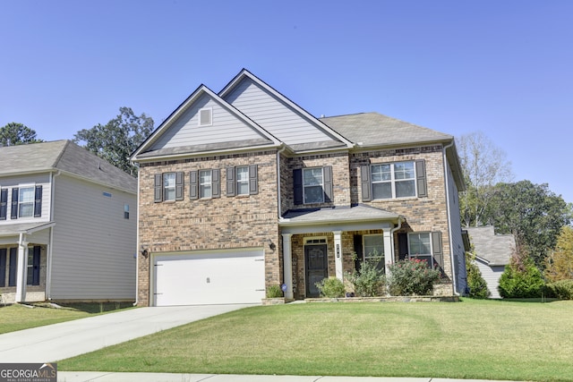 craftsman house featuring a garage and a front yard