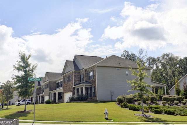 view of side of property with a yard