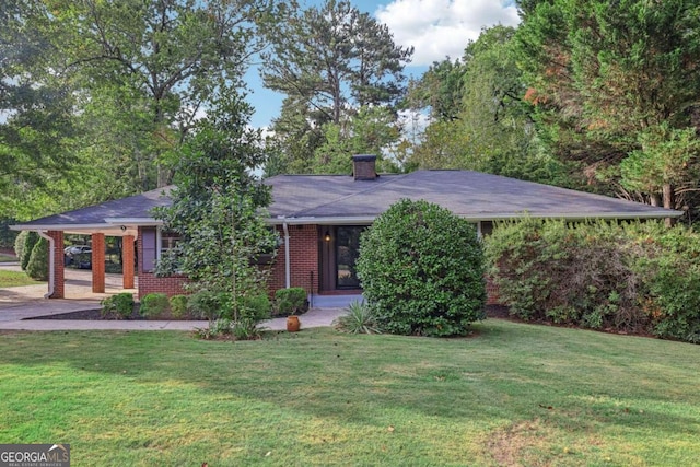 2347 Lavista Rd NE, Atlanta, GA 30329 - ranch-style home featuring a carport, a front lawn, a chimney, and brick siding
