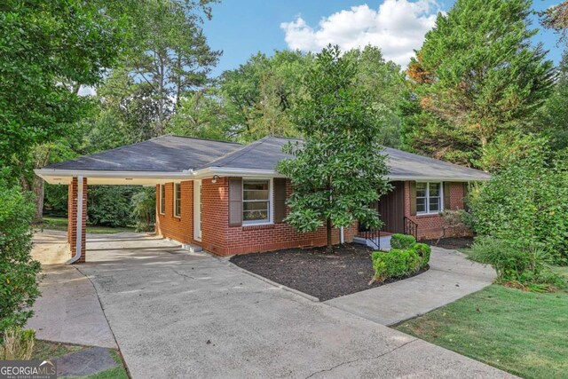 ranch-style house with a carport