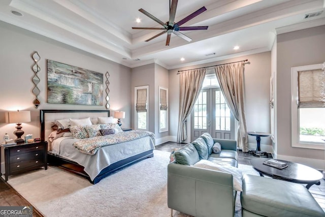 bedroom featuring wood-type flooring, multiple windows, ceiling fan, and crown molding