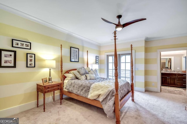 bedroom featuring connected bathroom, ceiling fan, light colored carpet, and crown molding