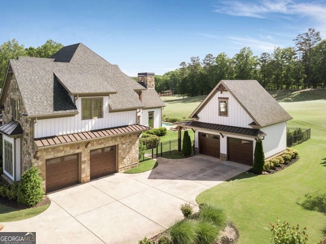 view of front of house featuring a garage and a front yard