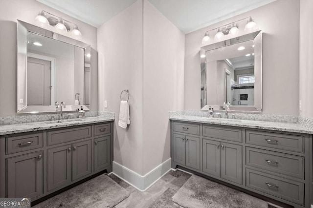 bathroom with decorative backsplash and vanity