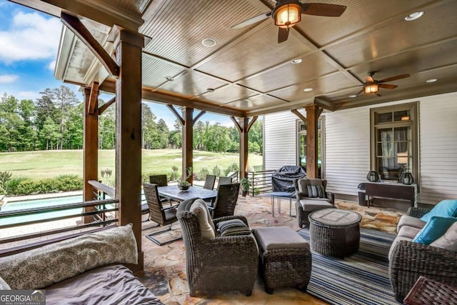 view of patio / terrace with an outdoor living space and ceiling fan