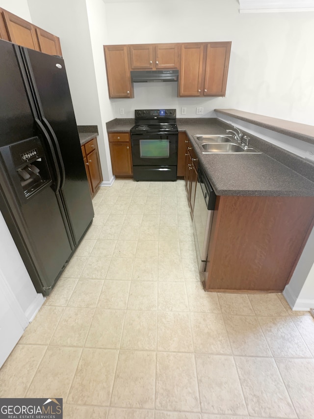 kitchen with black appliances, sink, and light tile patterned floors