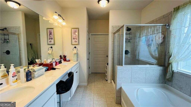 bathroom with tile patterned flooring, vanity, and separate shower and tub