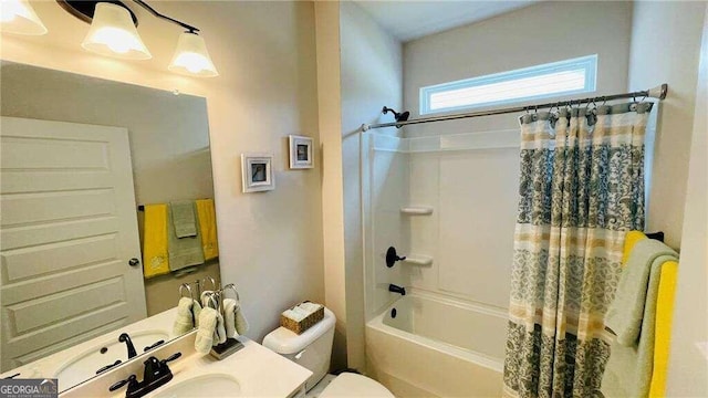 full bathroom with shower / tub combo with curtain, vanity, and toilet