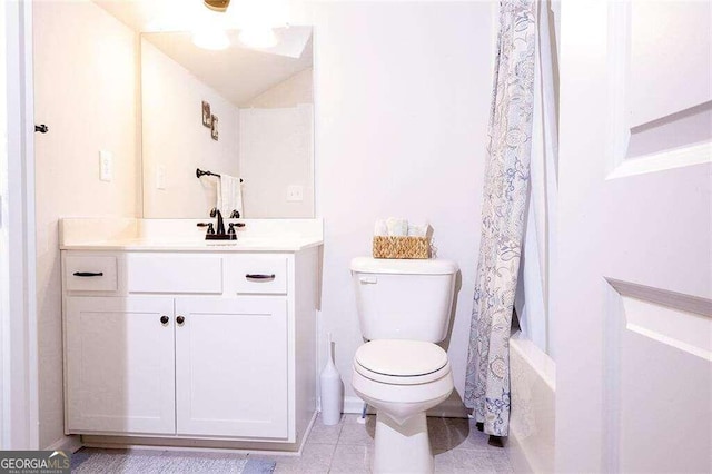 full bathroom with vanity, tile patterned flooring, shower / tub combo, and toilet