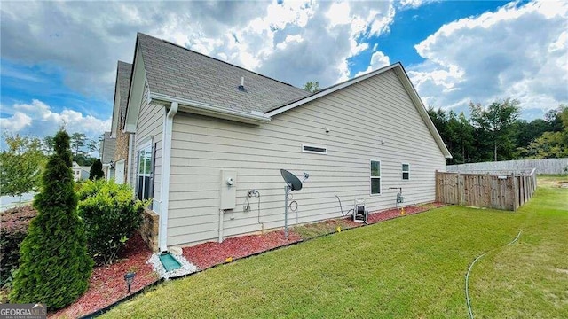 view of home's exterior featuring a yard