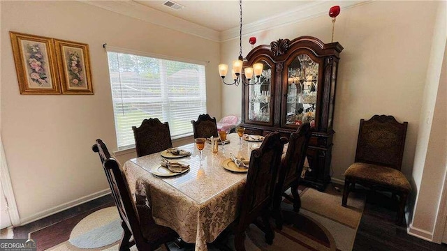 dining space featuring an inviting chandelier and crown molding