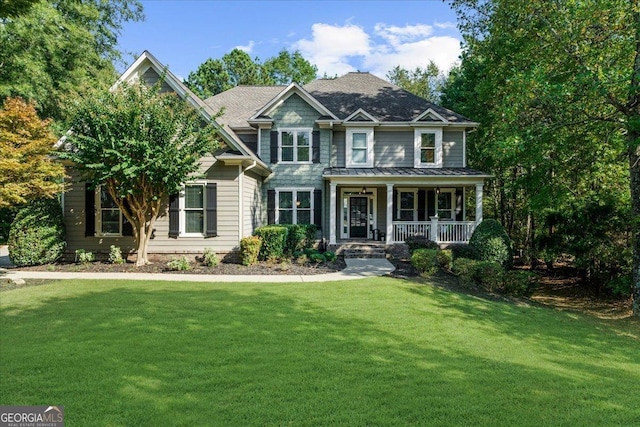 view of front of home featuring a front yard and a porch