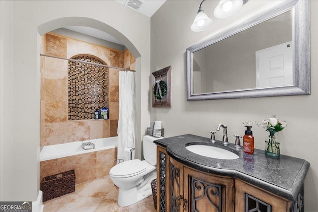 full bathroom with vanity, toilet, and shower / tub combo with curtain