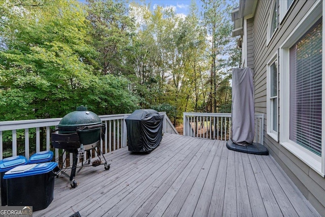 wooden deck featuring area for grilling