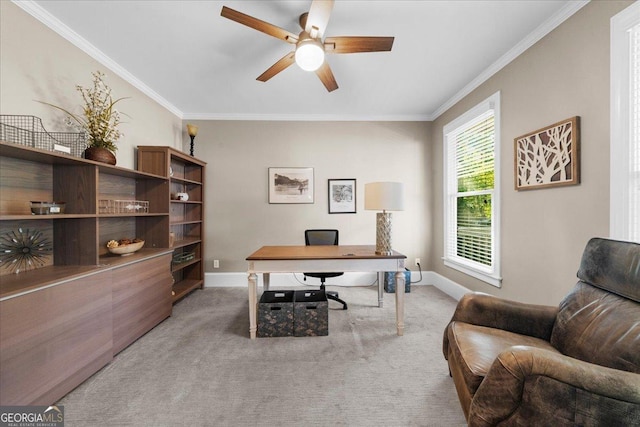 home office featuring light carpet, crown molding, and ceiling fan