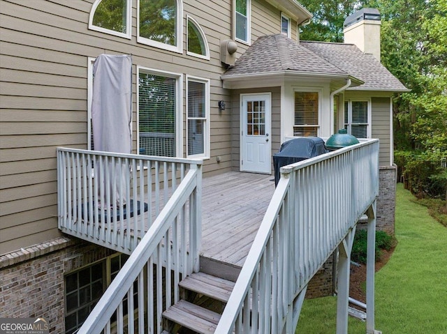 wooden terrace featuring grilling area