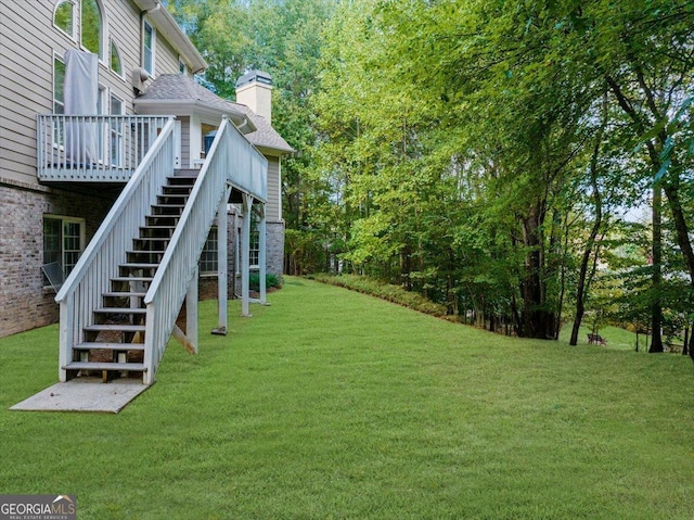 view of yard featuring a wooden deck