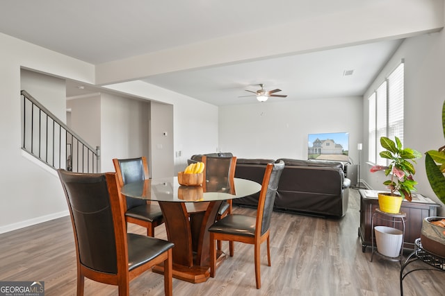 dining area featuring ceiling fan and hardwood / wood-style flooring