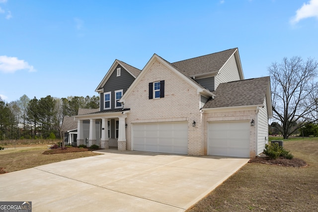 view of front of home featuring a garage and a front lawn