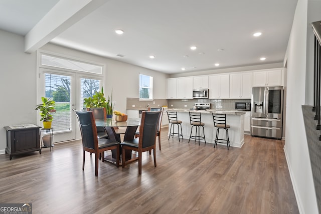 dining space featuring dark hardwood / wood-style floors