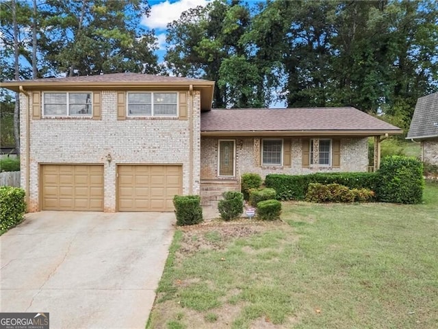 tri-level home featuring a front lawn and a garage