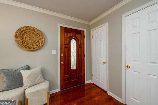 entrance foyer with dark hardwood / wood-style flooring and crown molding