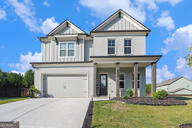 view of front of house featuring a garage and a front lawn