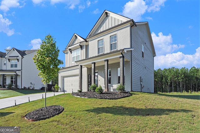 front of property featuring a front yard and a garage