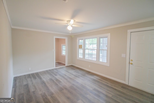 interior space featuring hardwood / wood-style flooring, ceiling fan, and ornamental molding