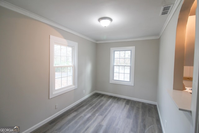 unfurnished room featuring dark hardwood / wood-style floors and crown molding