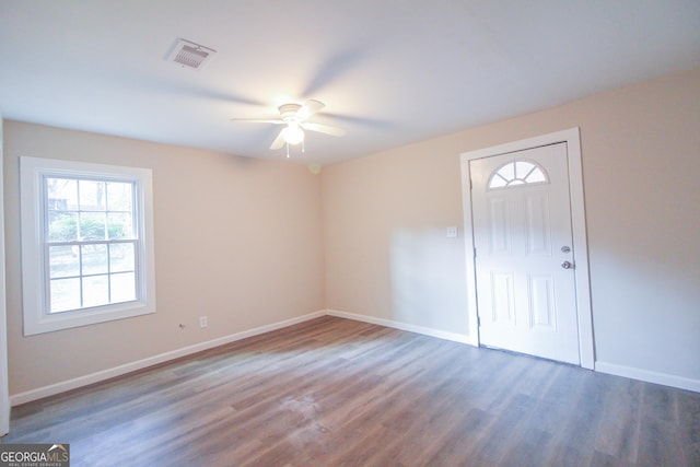 spare room with ceiling fan, dark hardwood / wood-style flooring, and a healthy amount of sunlight