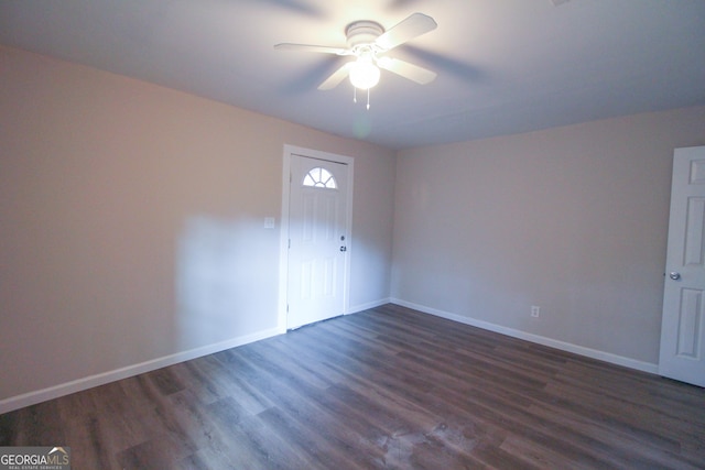 unfurnished room featuring ceiling fan and dark hardwood / wood-style flooring