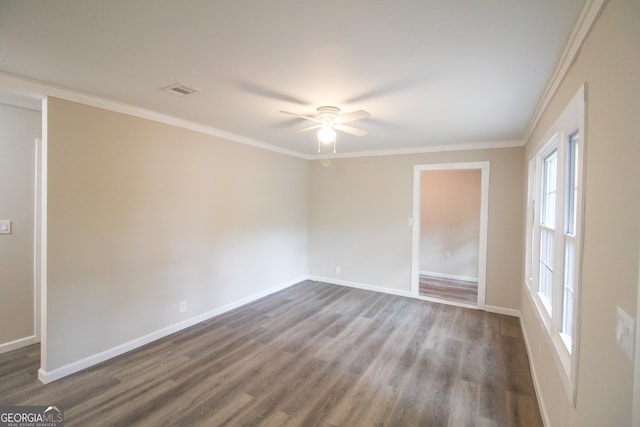 empty room featuring wood-type flooring, ceiling fan, and ornamental molding