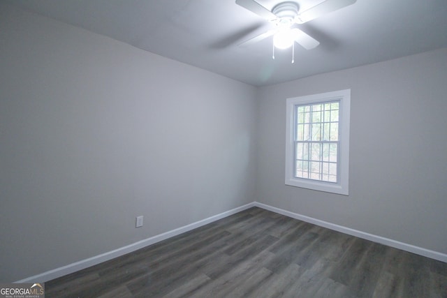 unfurnished bedroom featuring ceiling fan, dark wood-type flooring, and a closet