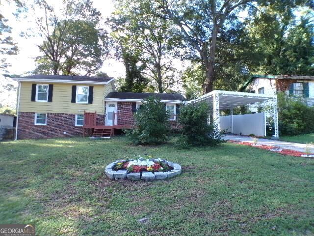 exterior space featuring a carport and a front lawn