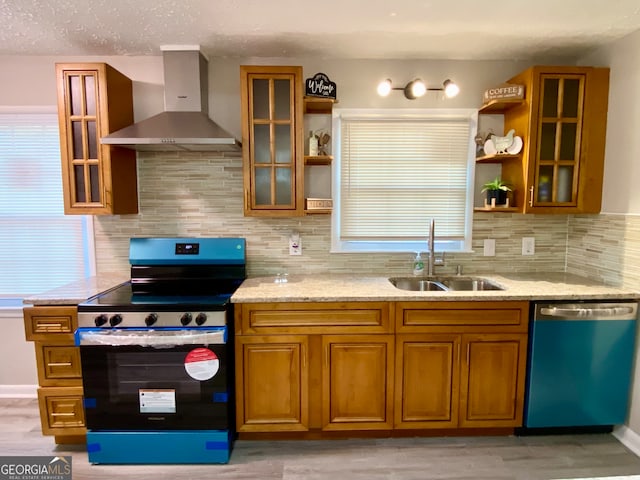 kitchen featuring dishwasher, stove, wall chimney range hood, sink, and tasteful backsplash