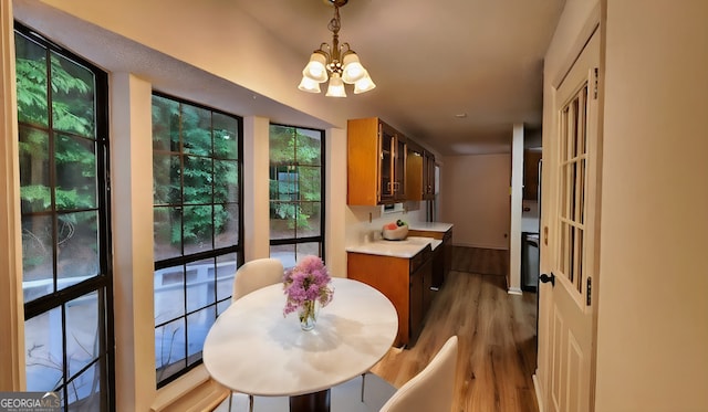 dining area with a chandelier and dark hardwood / wood-style floors