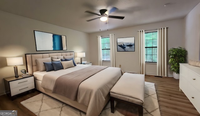 bedroom featuring dark hardwood / wood-style flooring and ceiling fan