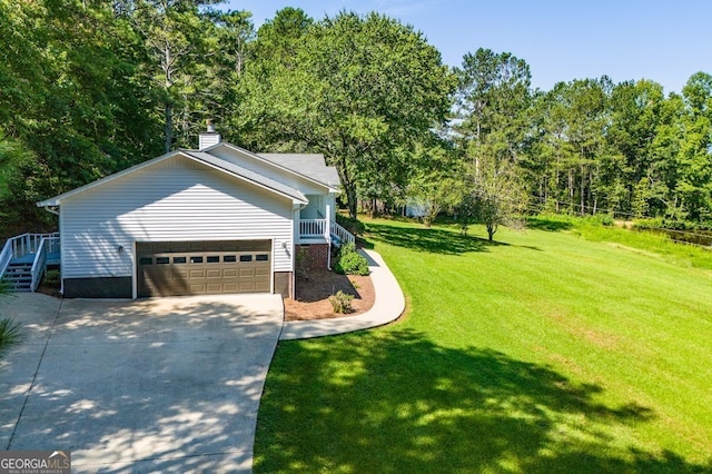 exterior space featuring a front yard and a garage