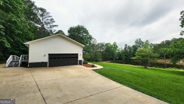 garage featuring a yard