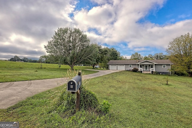 ranch-style house featuring a garage and a front lawn