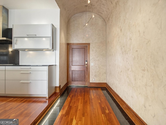 interior space with dark hardwood / wood-style flooring