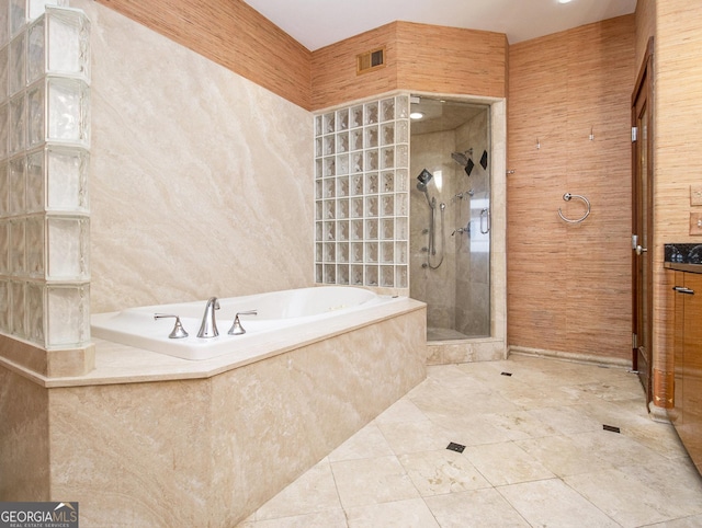 bathroom with shower with separate bathtub and vanity