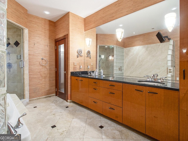 bathroom featuring beamed ceiling, vanity, and a shower with shower door