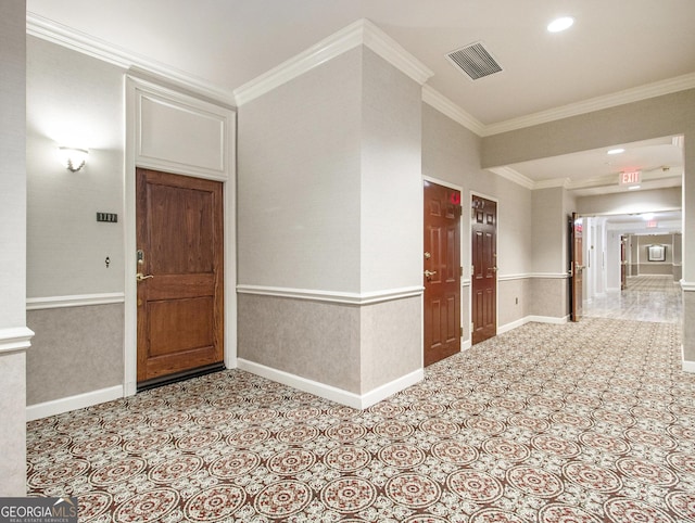 entryway featuring crown molding