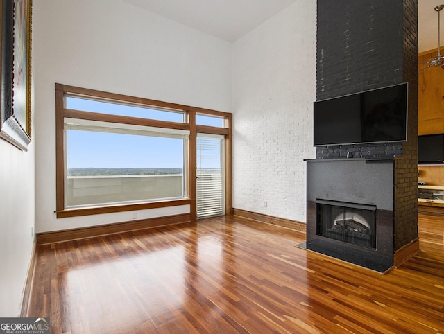 unfurnished living room featuring hardwood / wood-style flooring