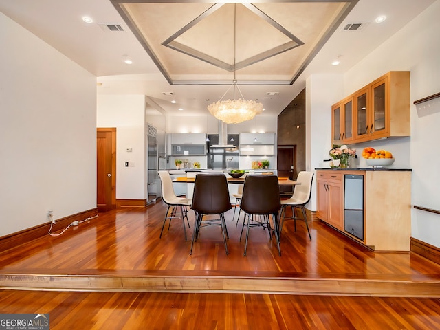 dining room with a chandelier and dark wood-type flooring